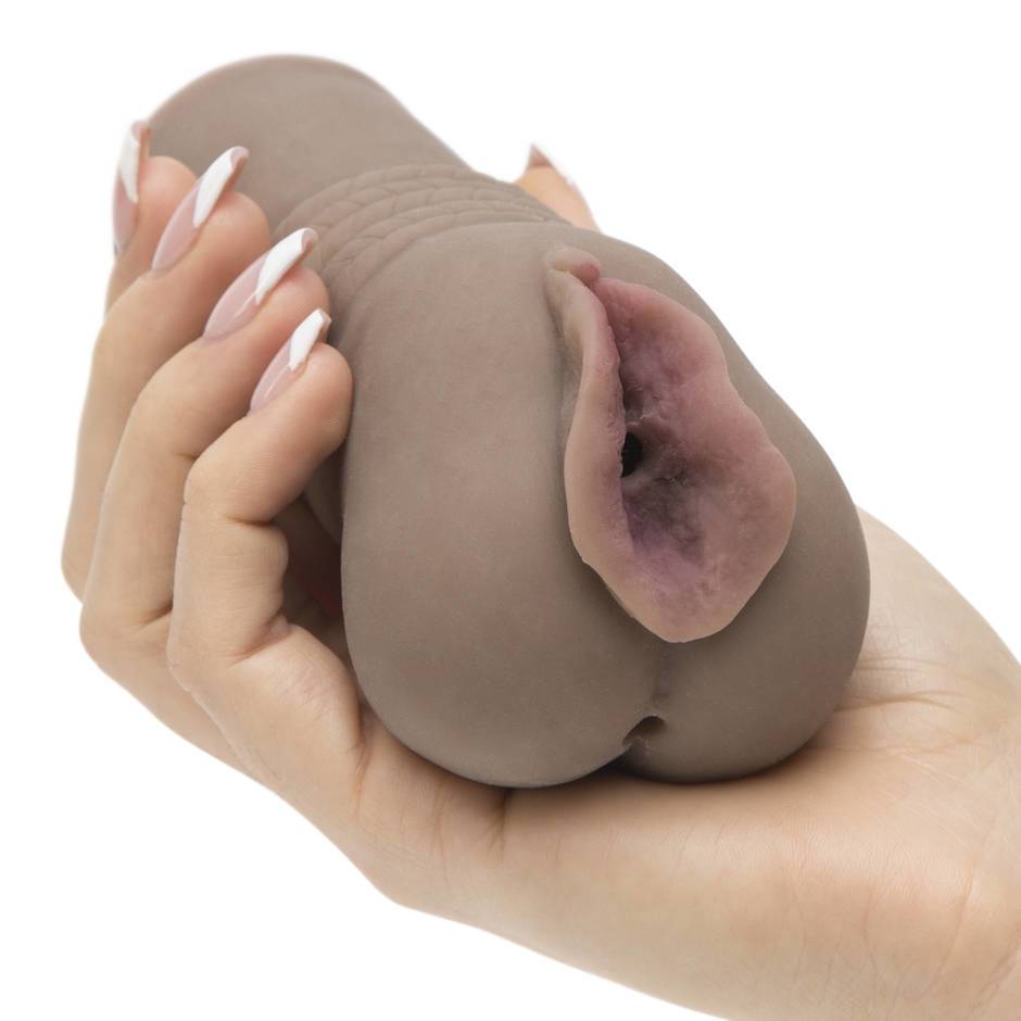 brown pocket pussy being held by female hand